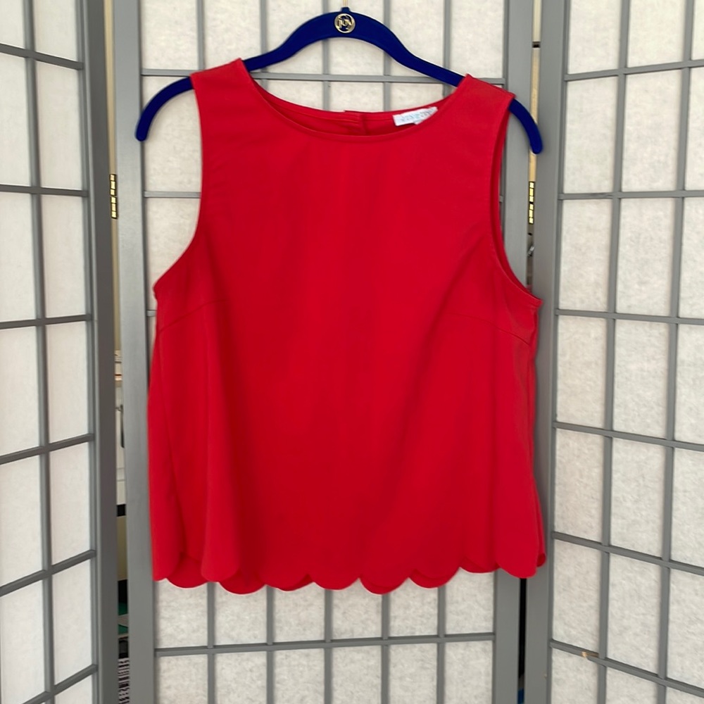 Red sleeveless blouse with scalloped hem